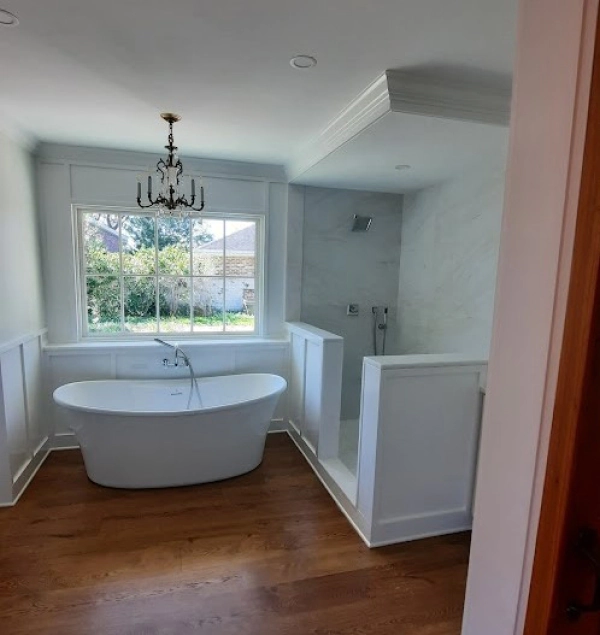 Master Bathroom Oasis with standalone soaker tub and frameless glass shower